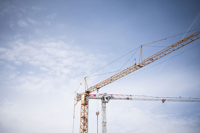 big-lifting-cranes-at-construction-site-picjumbo-com